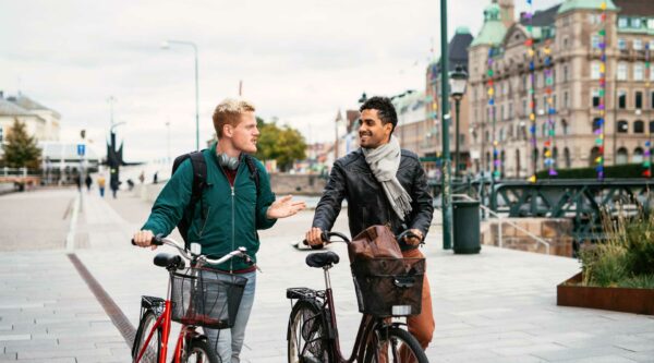 Two young men with bikes