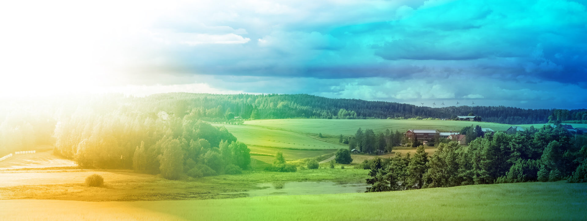 Maalaismaisema, jossa maatila ja tuulimyllyjä